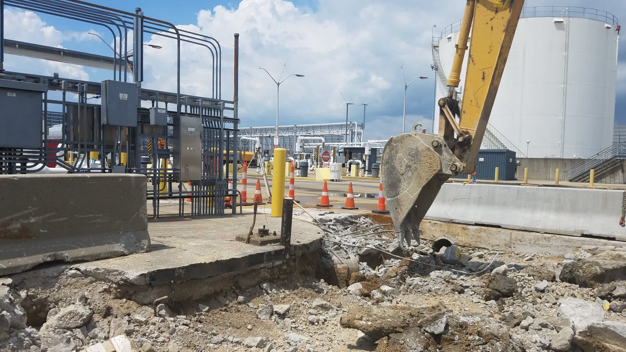 Backhoe Removes Cement Foundation