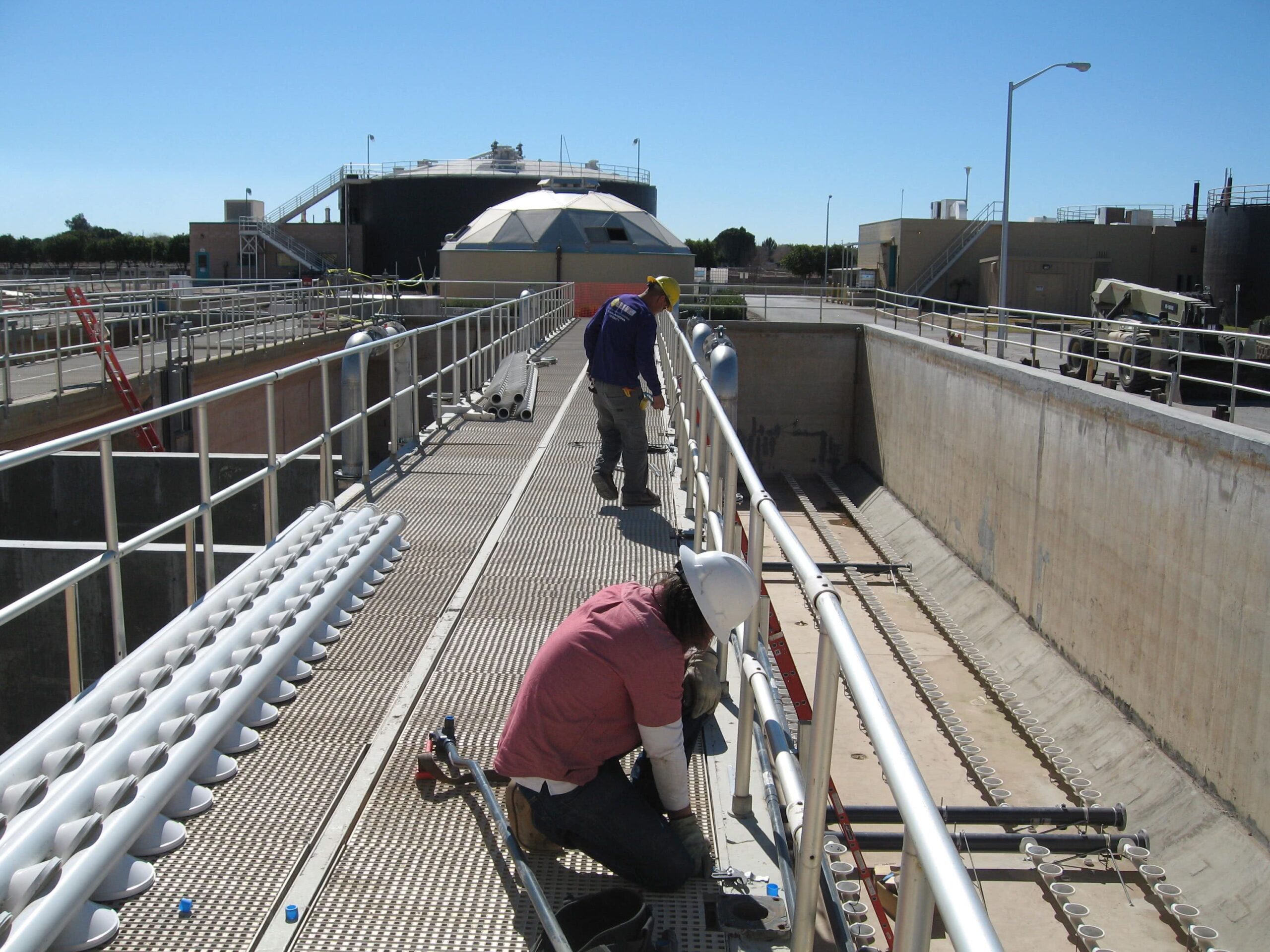 Workers Checking Supports on Walkway