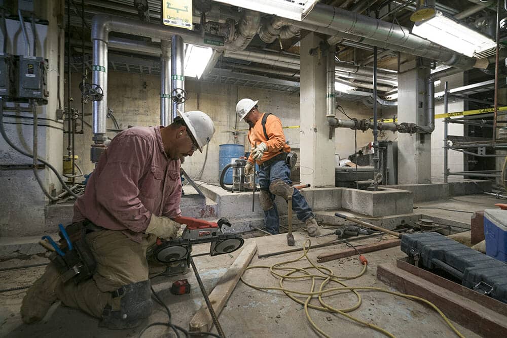 Contractors Cutting Rebar for Supports