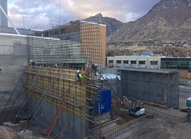 Worker Setting Frame Cement Walls