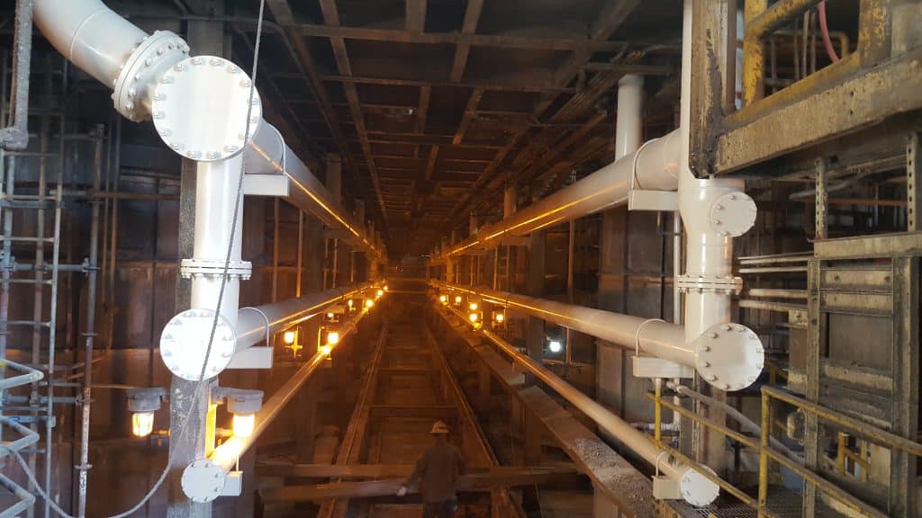 Worker Setting Beams Pipeline Passageway